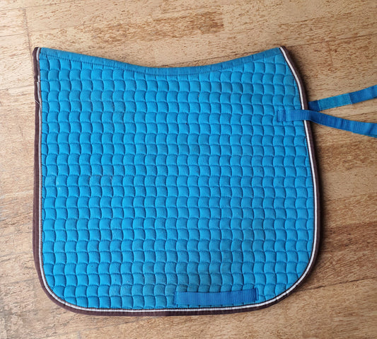 Turquoise dressage saddle pad with brown piping. Full size
